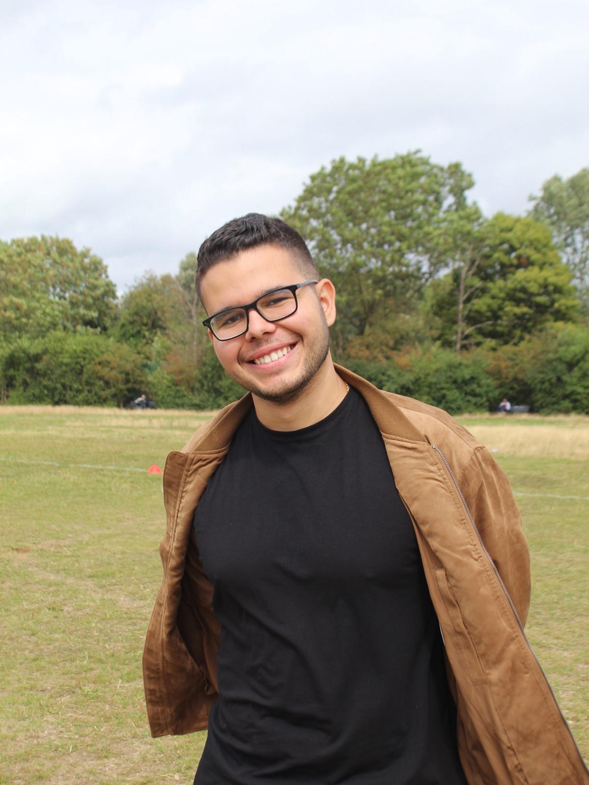 Cheerful photo of Nico, camp coach